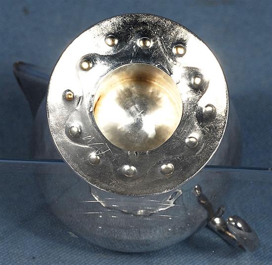 An Edwardian Arts & Crafts silver sparrow beak cream jug, Height 3 ¾”/90mm Weight 2.8oz/80grms